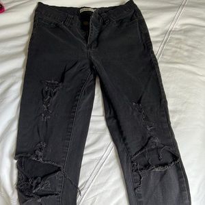 Distressed black denim jeans